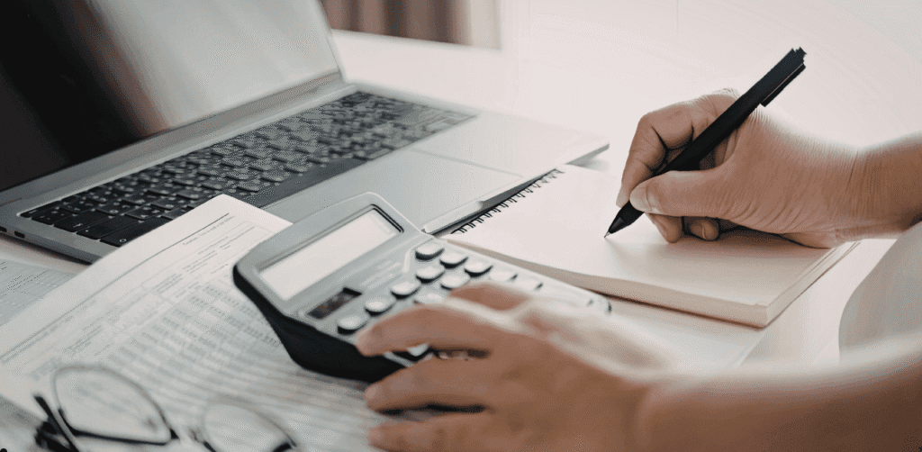 Person calculating financial risk for business note valuation