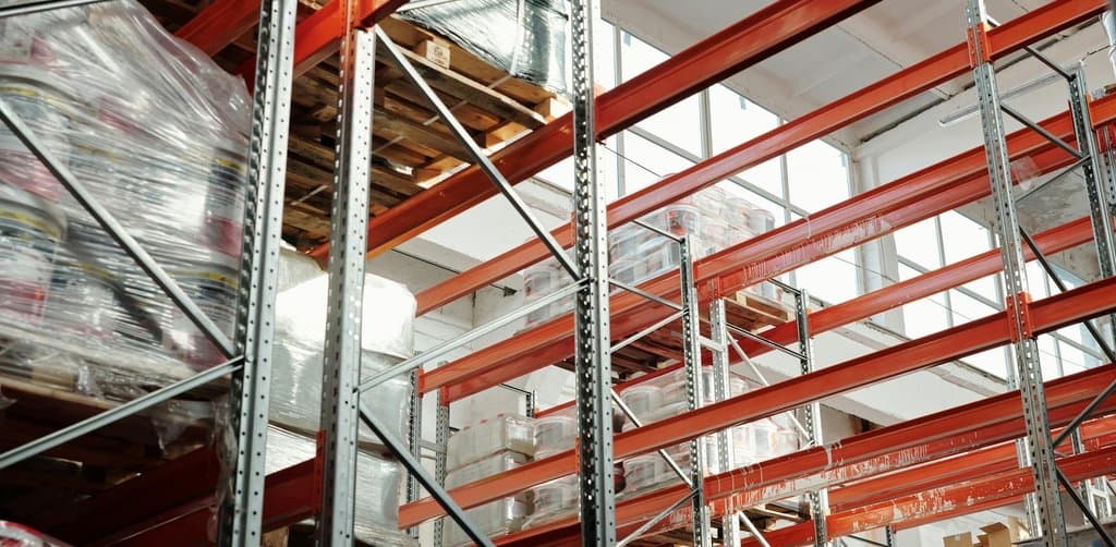 Warehouse with palletized inventory representing collateral pool for asset-based lending for business purchases