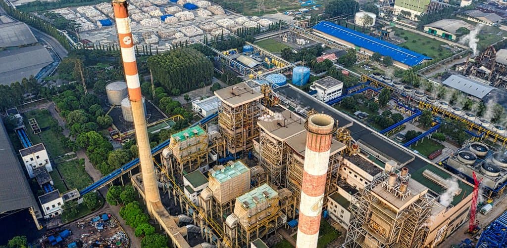 Aerial view of a sprawling industrial plant showing the breadth of what a blanket lien on all business assets actually covers