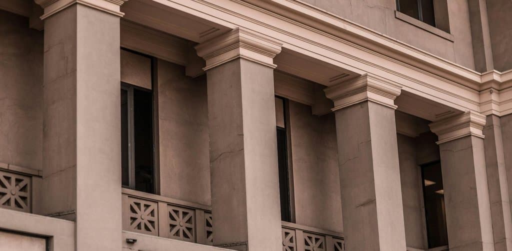 Classic columned bank facade representing the formal lender side of collateral agreements for business loans