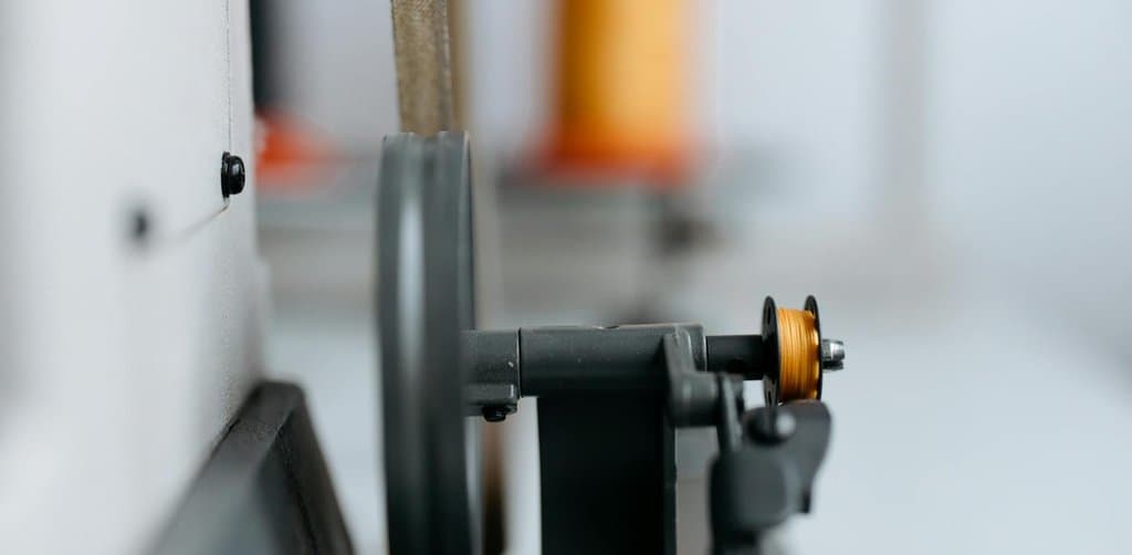 Close-up of a single industrial machine with belt drive, the kind of collateral typically covered by a specific UCC lien rather than a blanket lien