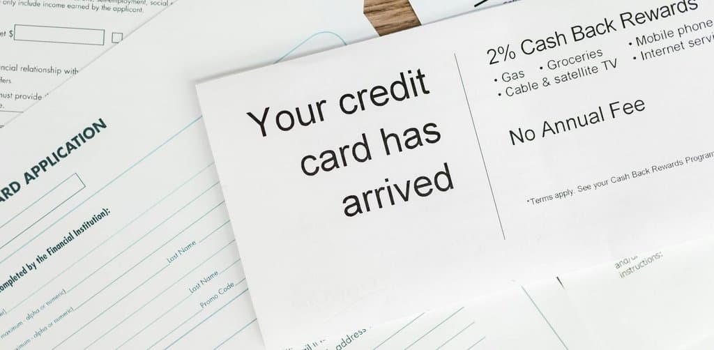 Income tax written in red ink with a calculator and red pen, illustrating the credit and tax consequences of a business lien
